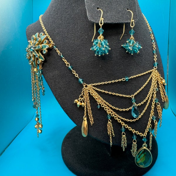 2028 by 1928 Jewelry Set Gold Tone, Aqua Blue Austrian Crystal and Enamel. Tiered Necklace, Floral Brooch and Crystal Dangle Earrings