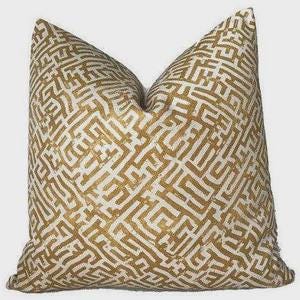 May include: Square decorative cushion featuring a gold maze pattern on a cream backdrop. The cushion has a soft, textured appearance, designed for home decor. The cushion is approximately 50 cm square.