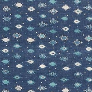 May include: Dark blue fabric with a repeating pattern of diamond shapes in white and shades of teal. The diamonds are outlined with small white dots, creating a textured appearance. This textile is suitable for various craft projects.