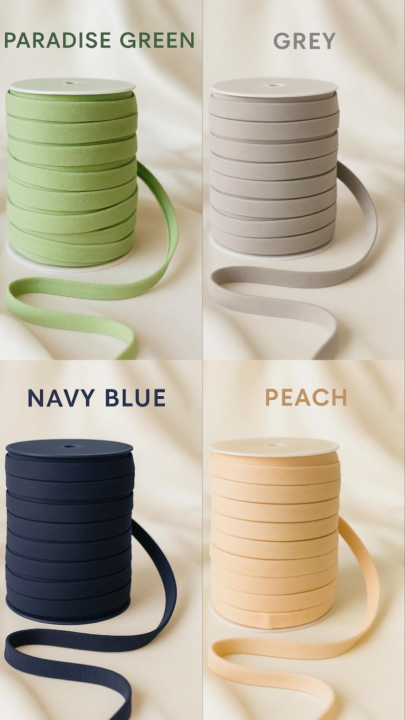 May include: Four spools of elastic ribbon in Paradise Green, Grey, Navy Blue, and Peach. Each spool is tightly wound, with a length of ribbon extending from the top. The colors are labeled with text above each spool.