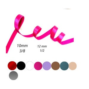May include: A bright pink satin ribbon in two widths: 10mm (3/8 inch) and 12mm (1/2 inch). The ribbon is shown coiled on a white background. A row of color swatches is shown below the ribbon.