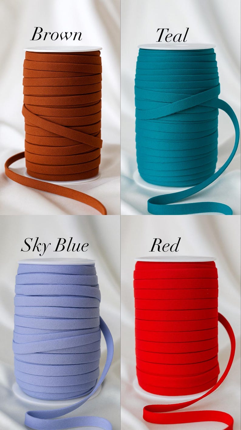 May include: Four spools of elastic ribbon in various colors: brown, teal, sky blue, and red. Each spool is labeled with its respective color name in a white font. The ribbon is neatly wound on white spools.