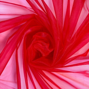 May include: Red tulle fabric with a soft, delicate texture. The fabric is gathered and draped, creating a flowing and elegant look.