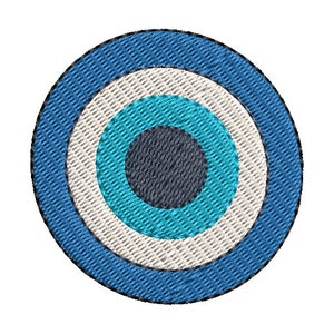 May include: Embroidered circular design featuring concentric rings of blue, light blue, white, and dark gray. The design is reminiscent of an eye, with a textured, stitched appearance, set against a white background.