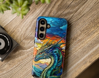 May include: A phone case with a colourful stained glass design featuring a blue dragon with yellow horns and a rainbow background.