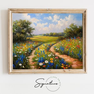 May include: A framed oil painting depicting a rural landscape with two dirt paths winding through a field of wildflowers. The flowers are in shades of blue, yellow, white, and pink, and the sky is a bright blue with fluffy white clouds.