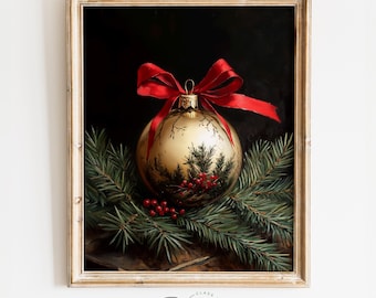May include: A gold Christmas ornament with a red bow and green pine branches. The ornament is decorated with a pine tree and red berries.