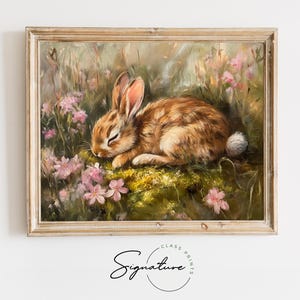 May include: A painting of a brown rabbit sleeping in a field of pink flowers. The rabbit is curled up on a bed of moss and surrounded by green foliage.