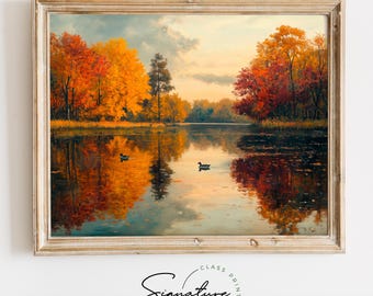 May include: A framed painting of a lake scene with fall foliage in shades of red, orange, and yellow. The lake is calm and reflects the trees. Two ducks are swimming in the water.