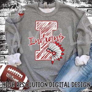 May include: A gray sweatshirt with a red and white graphic design of a capital letter I with the word "Indians" above it. A red and white headdress is partially visible behind the letter I.