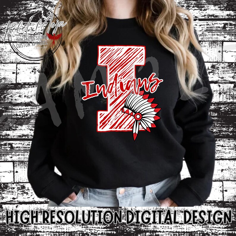 May include: Black sweatshirt with a red and white striped letter "I" and the word "Indians" in white text. A red and white headdress is to the right of the letter.