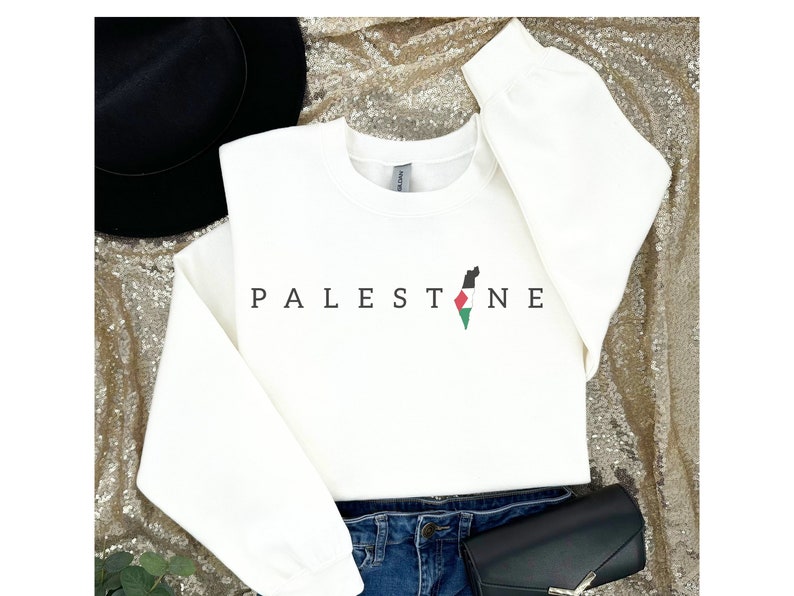 a white shirt with the word palestine on it