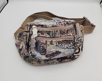 Riñonera Route 66 Pioneer Express con 6 bolsillos con cremallera y correa ancha ajustable de 114 cm.