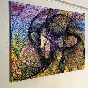 May include: Abstract art painting with a black and purple design on a canvas. The design is made up of overlapping circles and lines, creating a sense of depth and movement.