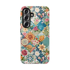 May include: A floral patterned phone case featuring a patchwork design with various flowers in shades of pink, orange, yellow, and blue. The case has a camera module with three lenses.