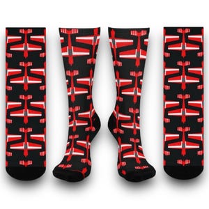 May include: A pair of black socks with a red and white airplane pattern. The socks are knee-high and have a black cuff.