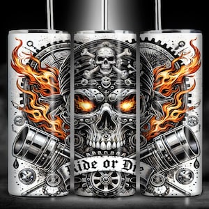 May include: A white stainless steel tumbler featuring a skull design. The skull is wearing a bandana and has flames emanating from its eyes. The text "Ride or Die" is printed on the tumbler.