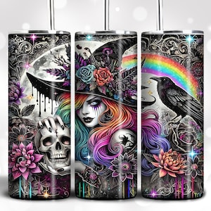 May include: Three stainless steel tumblers with a black and white design featuring a witch with rainbow hair, a skull, a raven, and flowers. The tumblers have a rainbow design on the side.