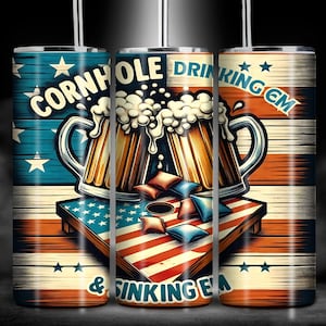 May include: Two red, white, and blue American flag themed tumblers with a graphic of two beer mugs pouring into a cornhole board with the text "Cornhole Drinking 'Em & Sinking 'Em".