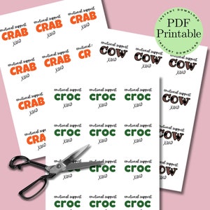 May include: Printable stickers with the text "emotional support" and various animal names, including "crab", "cow", and "croc". The stickers are in various colors, including orange, green, and brown.