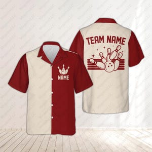 May include: A short-sleeved bowling shirt with a cream and burgundy color block design. The front features a bowling pin and ball graphic with the word "NAME". The back displays "TEAM NAME" above a bowling graphic.