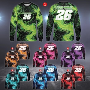 May include: Long-sleeved shirts with a swirling pattern in various colors, including green, orange, pink, purple, teal, blue, and red. Each shirt features the number "26" and the text "YOUR NAME" on the back. The shirts have black cuffs and a crew neck.