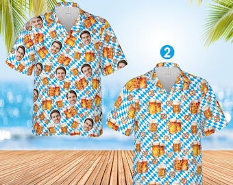 May include: Two short-sleeved button-down shirts with a beer-themed pattern. The shirts feature a repeating design of beer mugs, pretzels, and a face on a blue and white checkered background. The shirts are on a wooden surface with a beach and palm trees in the background.