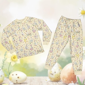 May include: A set of three ceramic mugs with a speckled, matte finish. The mugs are in shades of cream, light gray, and dark gray. Each mug has a simple, minimalist design and a rounded handle.