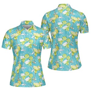 May include: A blue and green short-sleeved polo shirt with a pattern of margarita glasses and lime slices.