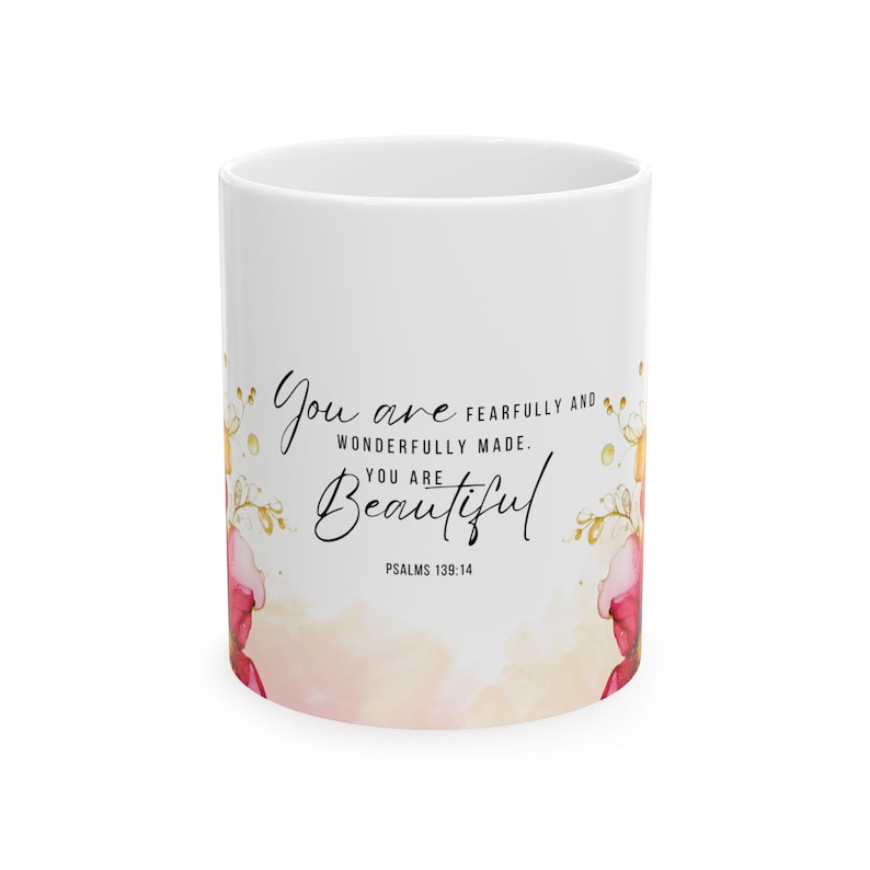 May include: White ceramic mug with a pink and gold floral design. The mug features the text "You are fearfully and wonderfully made. You are beautiful. Psalms 139:14"