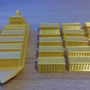 May include: A set of gold-coloured toy cargo containers and a toy cargo ship. The containers are stacked in rows and the ship is in the centre of the image.