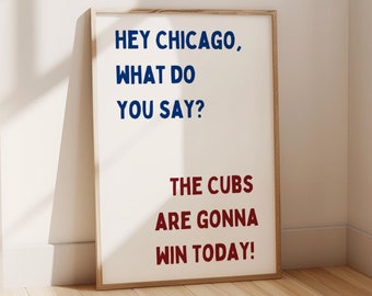 May include: A framed print with the text "HEY CHICAGO, WHAT DO YOU SAY? THE CUBS ARE GONNA WIN TODAY!" in blue and red lettering on a white background.