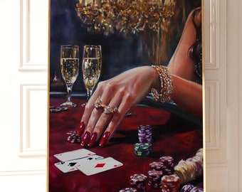 May include: A painting of a woman's hand playing poker with a red felt table, chips, and two playing cards. The woman is wearing jewelry and there are two glasses of champagne in the background.