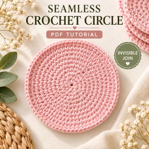 May include: A light pink crocheted circle with a textured stitch pattern. The image includes text that reads SEAMLESS CROCHET CIRCLE PDF TUTORIAL and INVISIBLE JOIN. The design features a circular shape with a consistent yarn tension throughout.
