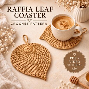 May include: A tan crochet leaf-shaped coaster with a small loop at the top. The text reads RAFFIA LEAF COASTER CROCHET PATTERN and PDF + VIDEO TUTORIAL. A white mug filled with coffee sits on a second identical coaster next to a wooden honey dipper.
