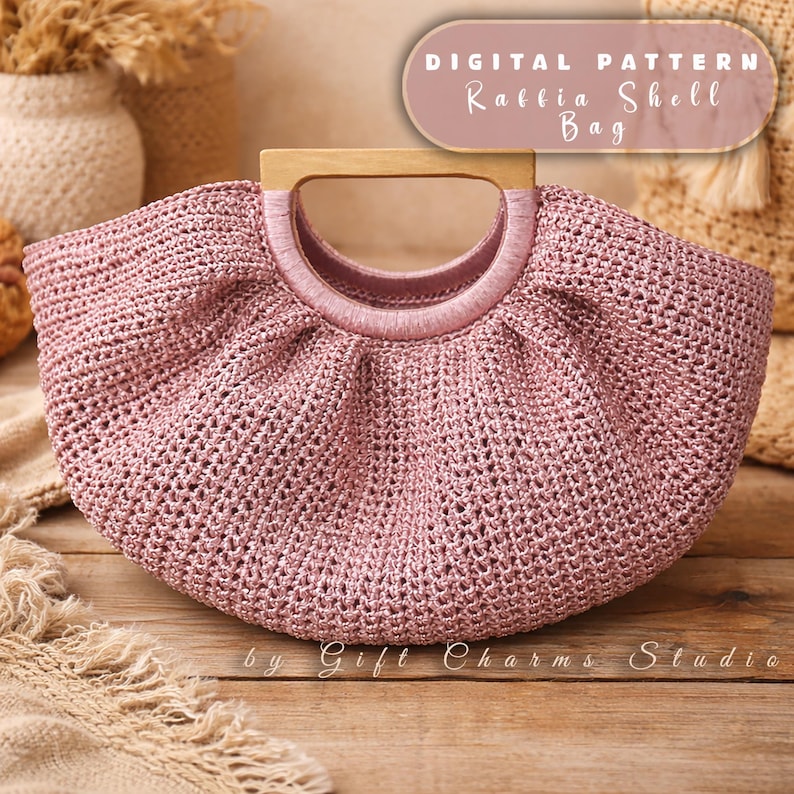 May include: A pink raffia shell bag with a wooden handle. The bag has a woven texture and a rounded shape. The text "DIGITAL PATTERN Raffia Shell Bag" is displayed on the top right. The text "by Gift Charms Studio" is displayed at the bottom.