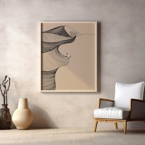 May include: A framed black and white line drawing of a desert landscape with a person standing on a dune. The drawing is on a beige background and is framed in a light wood frame.
