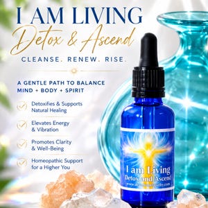 May include: A blue glass dropper bottle labelled I am Living Detox and Ascend with a black cap. The label features a glowing yellow figure and text. The bottle is surrounded by light-coloured crystals and a large, translucent teal glass vase.