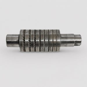 May include: A cylindrical metal roller featuring a series of alternating textured bands. The central section consists of repeating raised pyramid-shaped studs and fine vertical grooves, flanked by smooth, polished cylindrical ends on both sides.