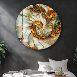 May include: A round wall art piece with a nautilus shell design. The artwork features a spiral pattern in shades of gold, white, and iridescent colors. The piece is mounted on a dark gray wall above a bed with white linens.