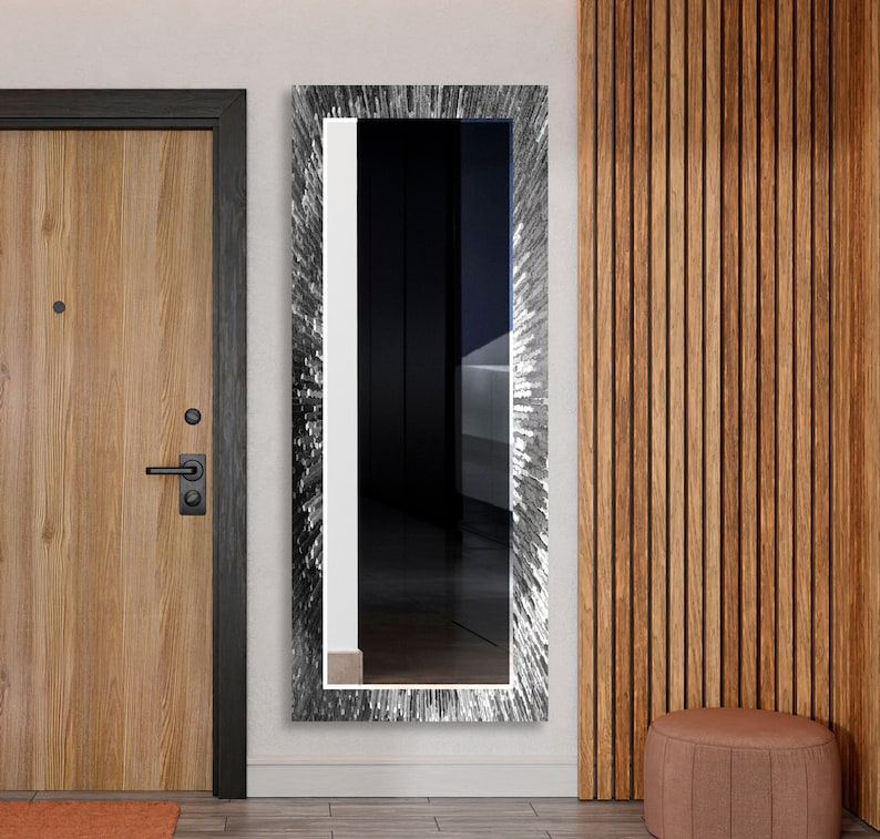 a door and a mirror in a room