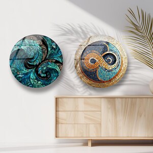 a minimalist interior design with a wooden cabinet, two round wall art pieces, and a potted plant on a white wall.