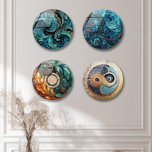 four decorative plates hanging on a wall, each with a unique design and color scheme.