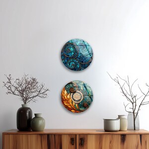 a wooden cabinet with two decorative plates hanging on the wall above it. The cabinet has a dark brown finish and is adorned with various decorative items, including two vases, a small plant, and a bowl.