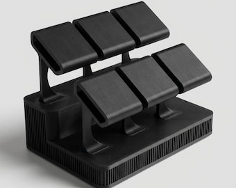 May include: A black watch display stand with six individual watch holders. The stand has a rectangular base with vertical lines and curved supports for each watch holder. The holders are rectangular and slightly curved.