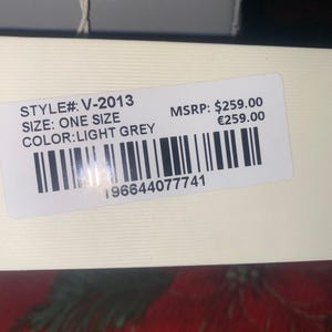 May include: A light grey product label with the text "STYLE#: V-2013", "SIZE: ONE SIZE", and "COLOR: LIGHT GREY". The label also includes a barcode and the number "196644077741".