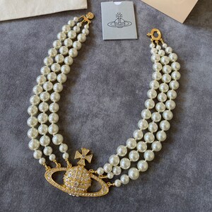 Three row pearl cheap bas relief choker