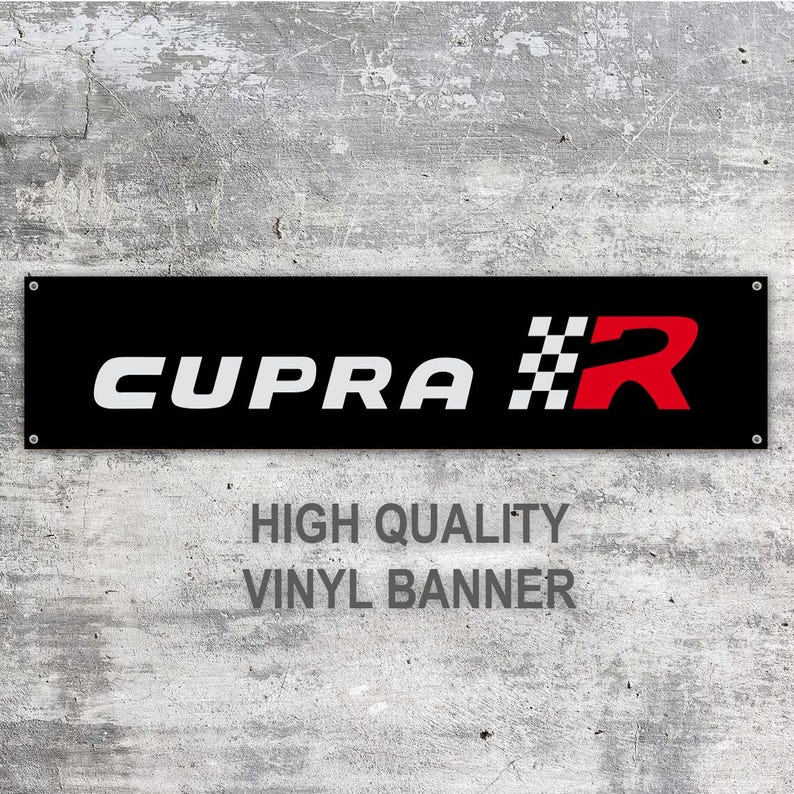 May include: A black vinyl banner with the word "CUPRA" in white block letters, a checkered flag design, and a red "R". The banner also includes the text "HIGH QUALITY VINYL BANNER".