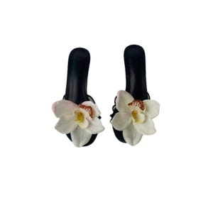 Cynthia White Cymbidium Orchid Black Sandal