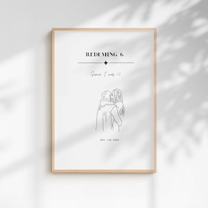 May include: A framed vertical wall art print featuring black line art of two people embracing. The text reads REDEMING 6, Since I was 12, and JOEY AND AOIFE. The design is centered on a white background with a light wood frame border.